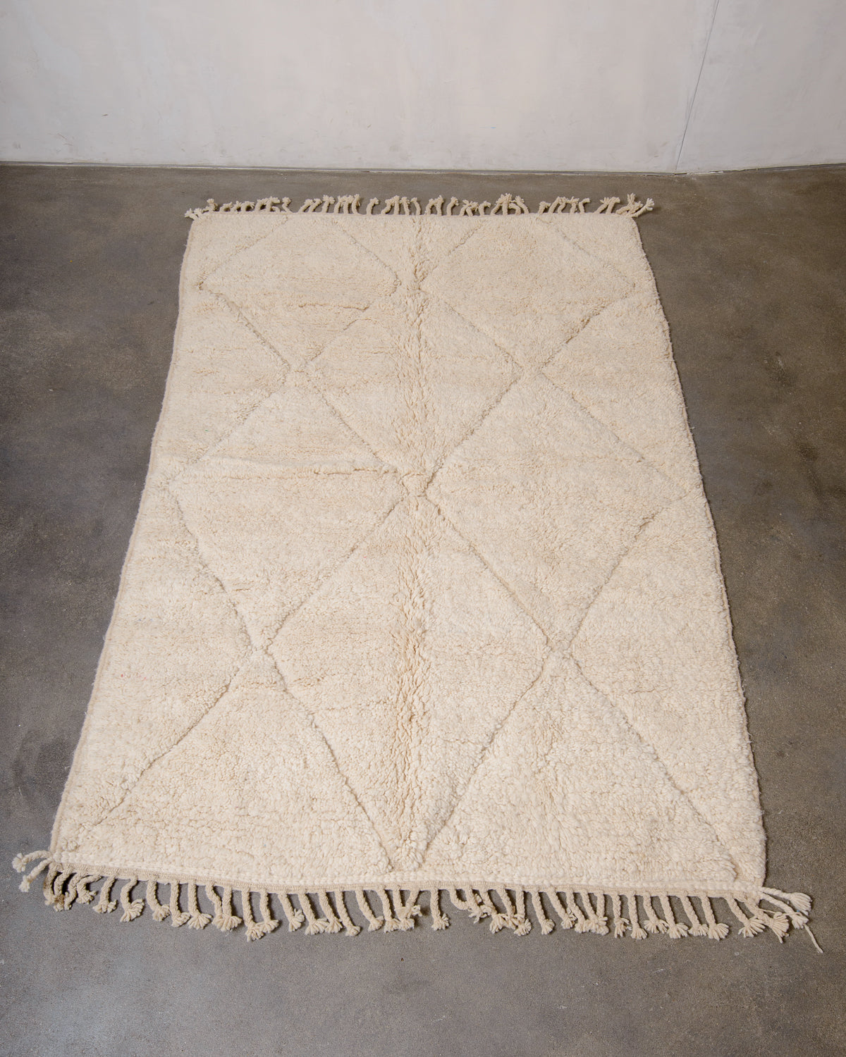 Modern, designer, handcrafted Berber rug from Morocco. Beniourain carpet with minimalist design, natural wool pile and a fluffy texture.